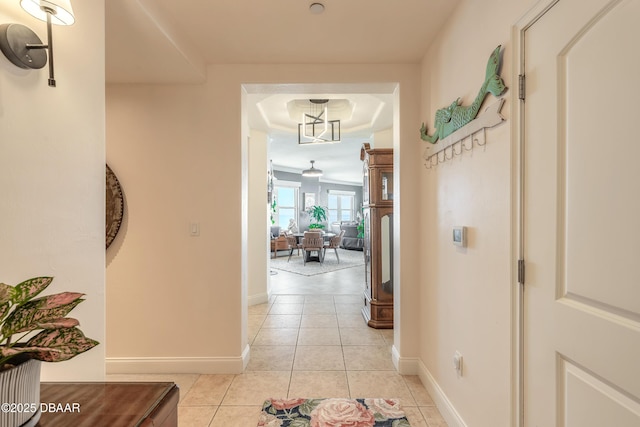 2515 S Atlantic Ave Unit 703, Daytona Beach, FL 32118 - hallway featuring light tile patterned flooring and a raised ceiling
