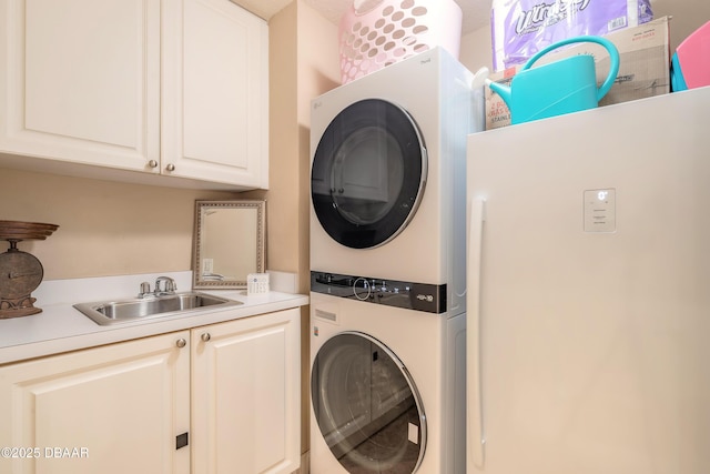 2515 S Atlantic Ave Unit 703, Daytona Beach, FL 32118 - laundry room with estacked washer and dryer and cabinet space