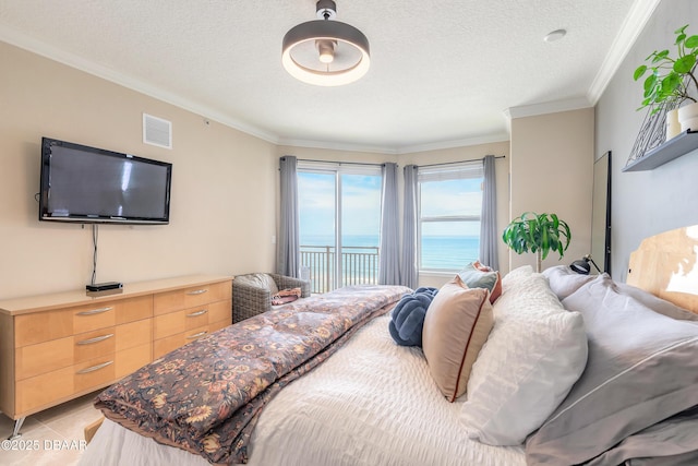 2515 S Atlantic Ave Unit 703, Daytona Beach, FL 32118 - bedroom featuring a water view, crown molding, a textured ceiling, and access to outside