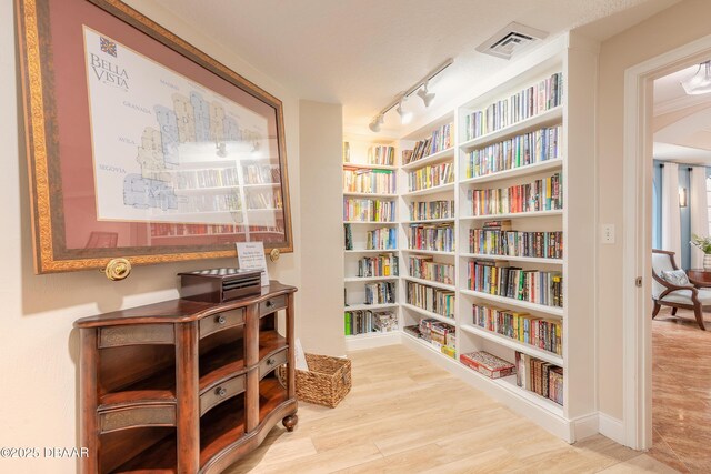 2515 S Atlantic Ave Unit 703, Daytona Beach, FL 32118 - sitting room with wood finished floors and rail lighting