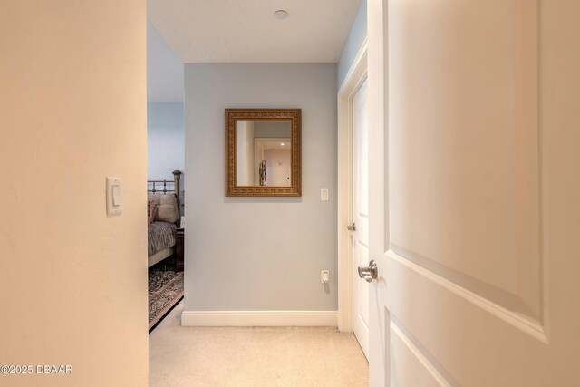 2515 S Atlantic Ave Unit 703, Daytona Beach, FL 32118 - hall with light colored carpet and baseboards