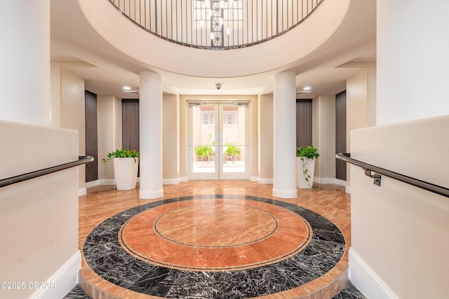 2515 S Atlantic Ave Unit 703, Daytona Beach, FL 32118 - entrance foyer with inlaid floor details, french doors, and a high ceiling