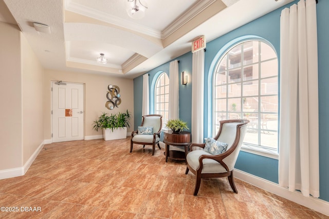 2515 S Atlantic Ave Unit 703, Daytona Beach, FL 32118 - living area featuring ornamental molding and a raised ceiling