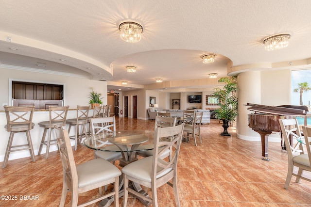 2515 S Atlantic Ave Unit 703, Daytona Beach, FL 32118 - dining room featuring a chandelier and ornamental molding