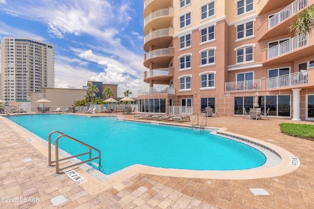 2515 S Atlantic Ave Unit 703, Daytona Beach, FL 32118 - community pool with a patio area