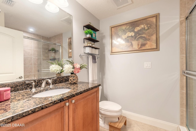 2515 S Atlantic Ave Unit 703, Daytona Beach, FL 32118 - bathroom with tile patterned flooring, a tile shower, and vanity