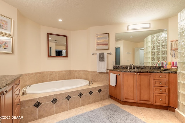 2515 S Atlantic Ave Unit 703, Daytona Beach, FL 32118 - full bath featuring vanity, tile patterned flooring, a bath, a textured ceiling, and recessed lighting