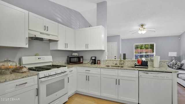 4 Starling Dr, Daytona Beach, FL 32117 - kitchen featuring white appliances, under cabinet range hood, a sink, light wood-type flooring, and white cabinets