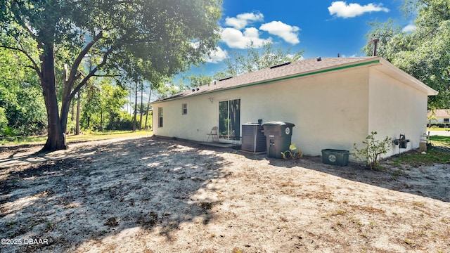 4 Starling Dr, Daytona Beach, FL 32117 - rear view of property featuring central AC and stucco siding