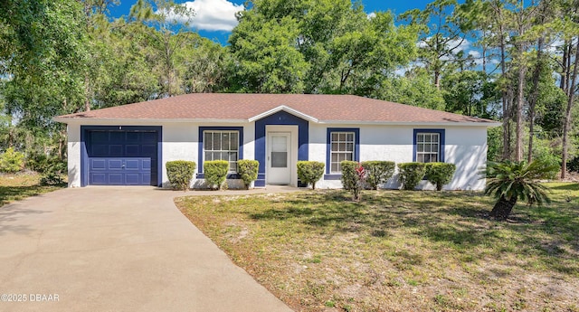 4 Starling Dr, Daytona Beach, FL 32117 - single story home featuring a garage, concrete driveway, stucco siding, and a front yard
