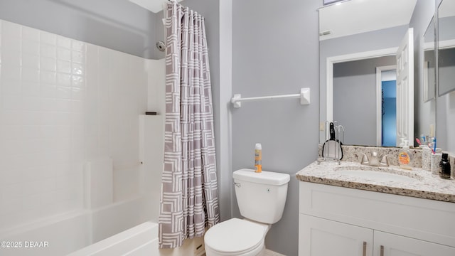 4 Starling Dr, Daytona Beach, FL 32117 - bathroom with toilet, vanity, and shower / bath combo with shower curtain