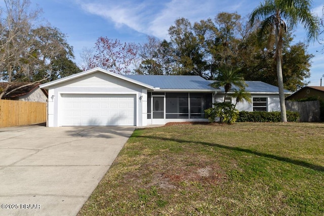 single story home with a garage, a front yard, and a sunroom