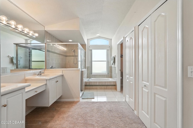 3776 Sweet Grove Ct, Port Orange, FL 32129 - bathroom featuring a closet, vanity, a stall shower, vaulted ceiling, and a garden tub