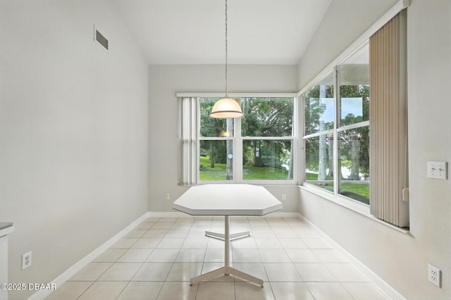 3776 Sweet Grove Ct, Port Orange, FL 32129 - unfurnished dining area featuring tile patterned floors and lofted ceiling