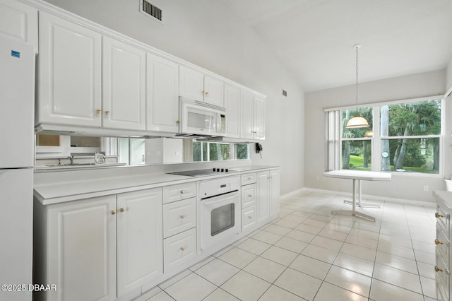 3776 Sweet Grove Ct, Port Orange, FL 32129 - kitchen featuring white appliances, white cabinets, light countertops, and high vaulted ceiling