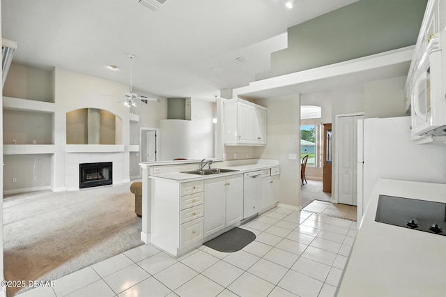 3776 Sweet Grove Ct, Port Orange, FL 32129 - kitchen with white appliances, light colored carpet, a ceiling fan, and light tile patterned floors