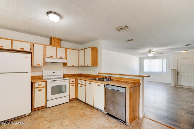188 W Sandalwood Ct, Daytona Beach, FL 32119 - kitchen with a sink, a ceiling fan, white appliances, a peninsula, and under cabinet range hood