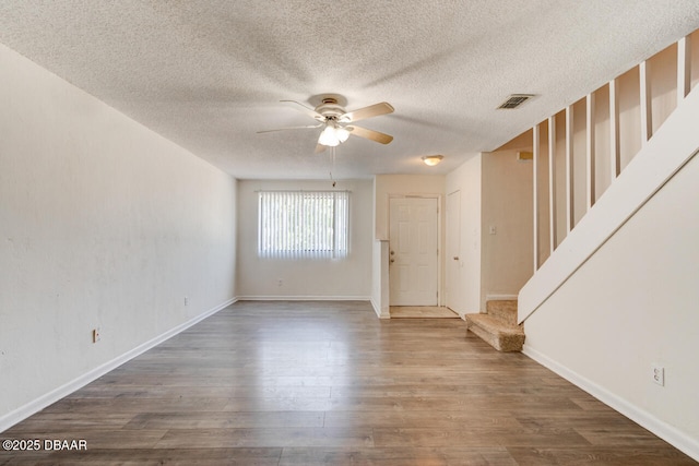 188 W Sandalwood Ct, Daytona Beach, FL 32119 - interior space with a textured ceiling, wood finished floors, a ceiling fan, and stairs