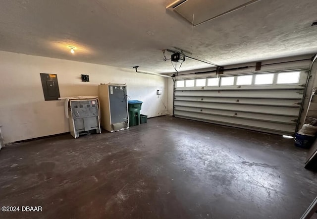 garage featuring electric panel and a garage door opener