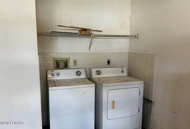 laundry area featuring washing machine and clothes dryer