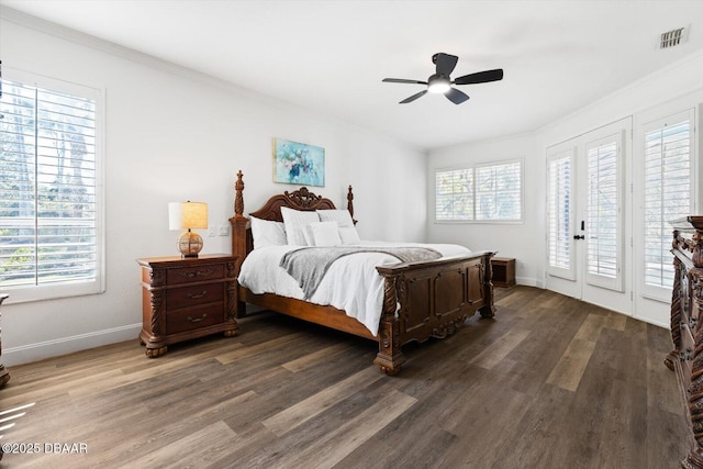 bedroom with dark wood-type flooring, ceiling fan, access to exterior, and multiple windows