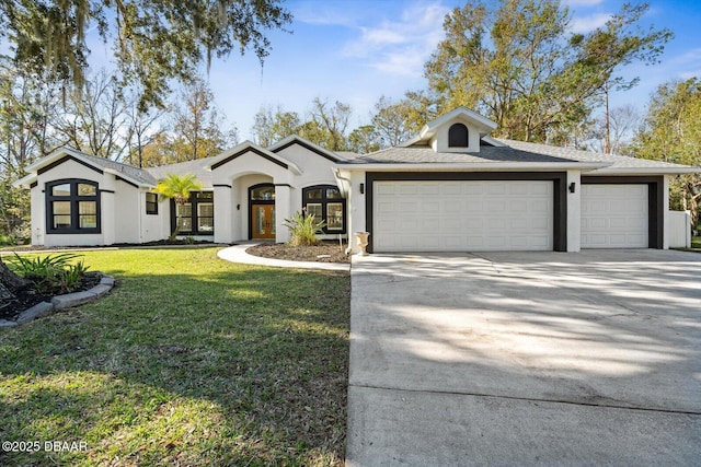 view of front facade featuring a garage and a front lawn