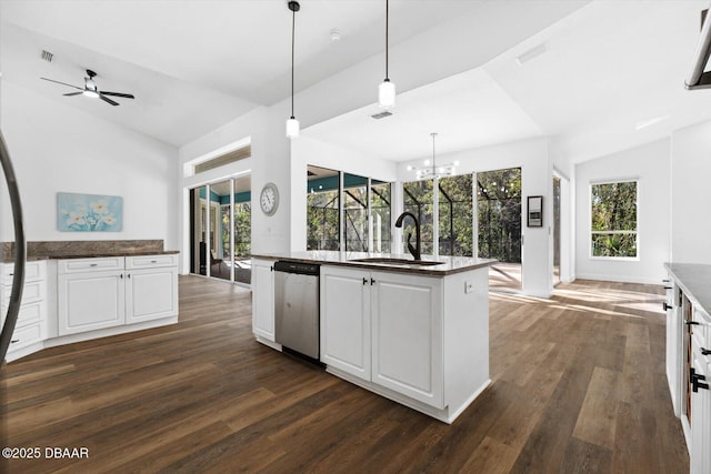 kitchen with pendant lighting, white cabinetry, dishwasher, lofted ceiling, and sink