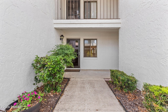 property entrance with a balcony