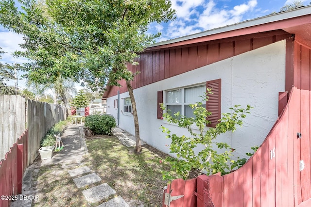 16 Red Maple Cir, Ormond Beach, FL 32174 - view of side of home featuring a fenced backyard and stucco siding