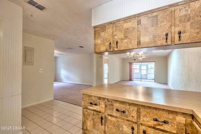 16 Red Maple Cir, Ormond Beach, FL 32174 - kitchen with light countertops, light tile patterned floors, visible vents, and open floor plan