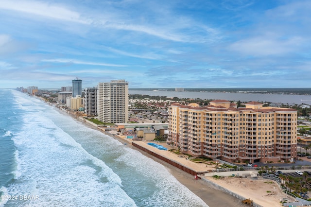 birds eye view of property featuring a view of the beach and a water view