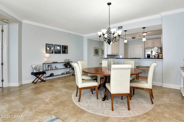 dining area with a notable chandelier and crown molding