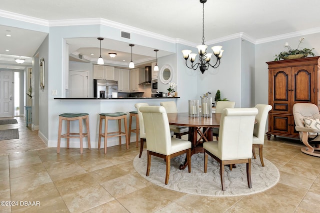 dining area with a chandelier and crown molding