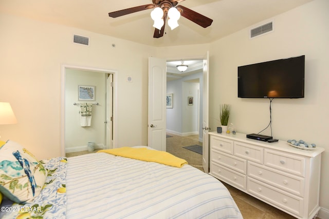 bedroom featuring dark tile patterned floors and ceiling fan