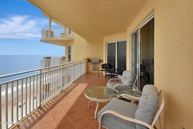 balcony featuring a water view