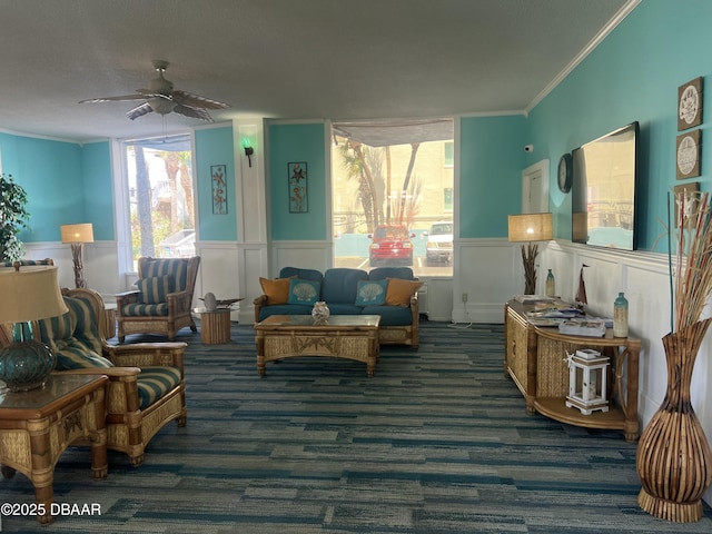 313 S Atlantic Ave Unit 221, Daytona Beach, FL 32118 - living area featuring ceiling fan, carpet flooring, ornamental molding, a wainscoted wall, and a decorative wall
