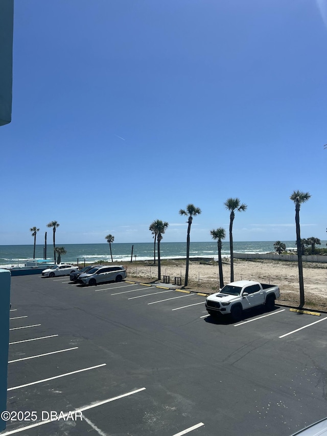 313 S Atlantic Ave Unit 221, Daytona Beach, FL 32118 - uncovered parking lot featuring a water view
