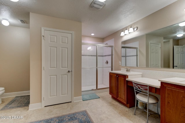 bathroom with visible vents, a sink, a shower stall, and double vanity