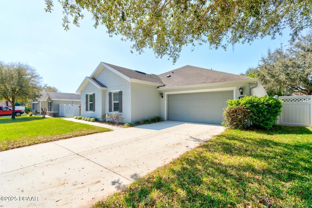 ranch-style home featuring stucco siding, a front yard, fence, a garage, and driveway