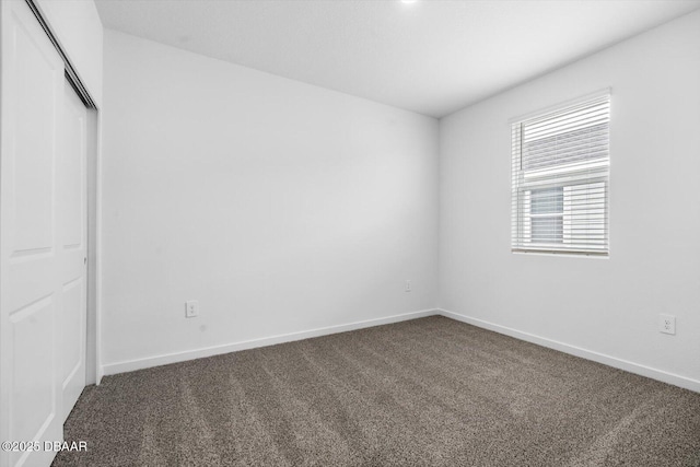 unfurnished room with carpet flooring