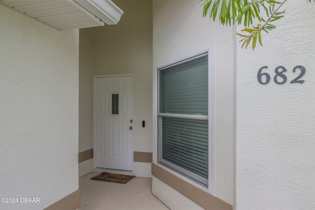 682 Middlebury Loop, New Smyrna Beach, FL 32168 - property entrance featuring stucco siding