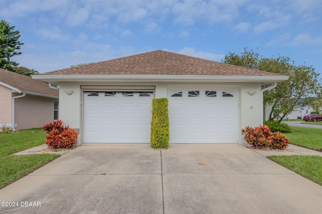 garage featuring a yard