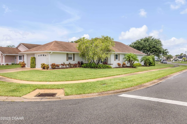 682 Middlebury Loop, New Smyrna Beach, FL 32168 - single story home with driveway, a front lawn, a garage, and stucco siding