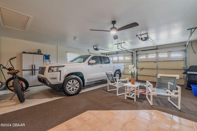 garage featuring a garage door opener and ceiling fan