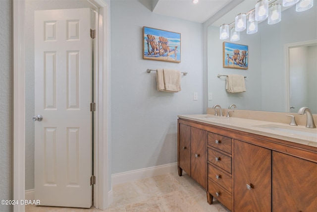 682 Middlebury Loop, New Smyrna Beach, FL 32168 - full bathroom with baseboards and double vanity