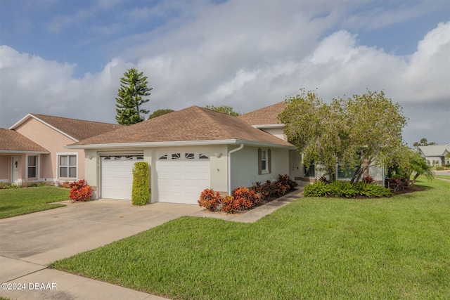 682 Middlebury Loop, New Smyrna Beach, FL 32168 - ranch-style house featuring an attached garage, a front yard, stucco siding, concrete driveway, and a shingled roof
