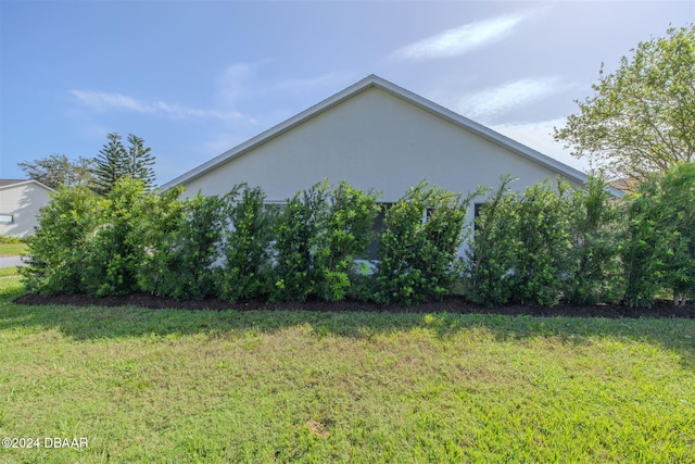 view of home's exterior featuring a yard