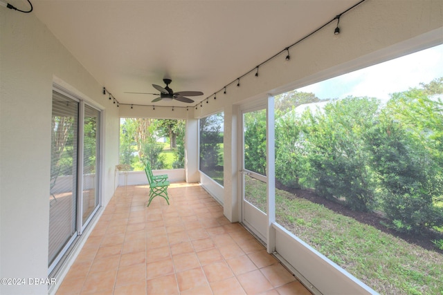 682 Middlebury Loop, New Smyrna Beach, FL 32168 - unfurnished sunroom featuring tile patterned floors
