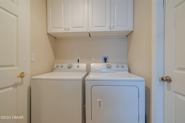 laundry area with cabinets and washer and dryer