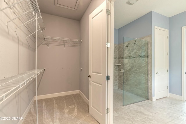 bathroom featuring a shower with door